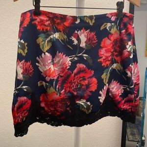 Urban Outfitters Bright floral skirt with black lace trim. Size large.